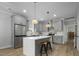Modern kitchen with gray cabinets, stainless steel appliances, and a center island with seating at 1105 Massey St, Smithfield, NC 27577