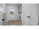 Functional laundry room with ample storage, a utility sink, and access to the backyard at 1105 Massey St, Smithfield, NC 27577