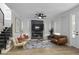 Bright living room boasts a decorative fireplace, stylish furniture, and a neutral color palette at 1105 Massey St, Smithfield, NC 27577
