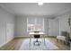 Bright office space with wood floors, natural light from large windows, and modern desk at 1105 Massey St, Smithfield, NC 27577