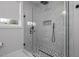 Sleek glass enclosed shower with marble tiles and black hardware at 1105 Massey St, Smithfield, NC 27577