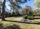 Spacious backyard with mature trees, lawn and a concrete patio at 1106 Northview St, Garner, NC 27529