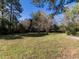 Expansive lawn with mature trees, creating a private backyard oasis at 1106 Northview St, Garner, NC 27529