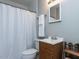 Bathroom featuring a wooden vanity with a sink and a shower tub at 1106 Northview St, Garner, NC 27529