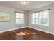 Bright, airy bedroom with gleaming hardwood floors and sun-drenched windows at 1106 Northview St, Garner, NC 27529