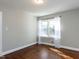 Inviting bedroom featuring a window with sheer curtains and hardwood floors at 1106 Northview St, Garner, NC 27529