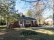 Charming brick home with a well-maintained front yard and a lovely garden bed near the entrance at 1106 Northview St, Garner, NC 27529