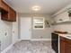 Kitchen featuring modern cabinets, black appliances, open shelving and neutral walls at 1106 Northview St, Garner, NC 27529