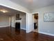 Open-concept with hardwood floors, fireplace in the living room, and open access to kitchen at 1106 Northview St, Garner, NC 27529