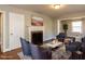 Cozy living room featuring hardwood floors, a fireplace, and comfortable seating area at 1106 Northview St, Garner, NC 27529