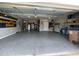 Spacious garage featuring epoxy flooring, storage, and ample room for vehicles at 1108 Mendocino St, Wake Forest, NC 27587