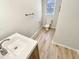 Bathroom showcasing a toilet, towel bar, and a white countertop vanity at 120 Chattleton Ct, Durham, NC 27712