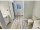 Clean and tidy bathroom featuring tile floors, a window and neutral paint at 120 Chattleton Ct, Durham, NC 27712
