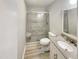 Bathroom featuring a glass door shower, toilet and a vanity with a granite countertop at 120 Chattleton Ct, Durham, NC 27712