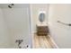 Bathroom featuring a vanity, oval mirror, and a combined tub and shower at 120 Chattleton Ct, Durham, NC 27712