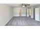 Large bedroom featuring neutral colored carpet and multiple closets and doorways at 120 Chattleton Ct, Durham, NC 27712