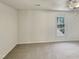 Bedroom with plush carpet and a window providing natural light at 120 Chattleton Ct, Durham, NC 27712