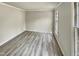 Bedroom showcasing neutral colored walls and flooring and natural light from large windows at 120 Chattleton Ct, Durham, NC 27712