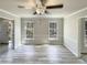 Dining room featuring wood-look flooring and abundant natural light from large windows at 120 Chattleton Ct, Durham, NC 27712
