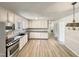 Spacious kitchen with white cabinets, vinyl flooring, and ample counter space at 120 Chattleton Ct, Durham, NC 27712