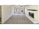 Bright living room featuring fireplace, neutral tones, and ample natural light at 120 Chattleton Ct, Durham, NC 27712