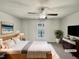 Bright main bedroom featuring a ceiling fan, large window and modern furnishings at 120 Chattleton Ct, Durham, NC 27712
