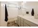 Bathroom features a double sink vanity with modern fixtures and a shower with a curtain at 129 Edgefield Dr, Sanford, NC 27332