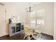 Bright breakfast nook with a round table, a view of the outdoors, and modern lighting at 129 Edgefield Dr, Sanford, NC 27332