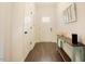 Bright hallway with hardwood floors and a decorative console table at 129 Edgefield Dr, Sanford, NC 27332