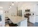 Bright kitchen featuring granite counters, white cabinetry, stainless appliances, and an island with seating at 129 Edgefield Dr, Sanford, NC 27332