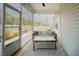 Inviting screened-in patio with an outdoor sitting area to enjoy the beautiful backyard view at 129 Edgefield Dr, Sanford, NC 27332