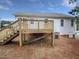 Backyard featuring a new wooden deck with stairs at 13 Herndon Ct, Clayton, NC 27520