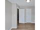 This bedroom features neutral walls, wood-look floors, and a bright ceiling light at 13 Herndon Ct, Clayton, NC 27520