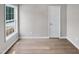 Empty bedroom showing the flooring, window, and neutral wall color at 13 Herndon Ct, Clayton, NC 27520