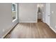 Bedroom featuring durable wood-look floors, neutral walls and access to the bathroom at 13 Herndon Ct, Clayton, NC 27520