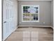 Bedroom featuring luxury vinyl plank flooring, neutral walls and a large window at 13 Herndon Ct, Clayton, NC 27520