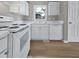 Bright kitchen with white appliances and laminate counters at 13 Herndon Ct, Clayton, NC 27520