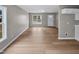 Open-concept living space with new wood-look floors, neutral walls and natural light at 13 Herndon Ct, Clayton, NC 27520