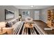 Bright living room with modern decor, featuring a striped rug and comfortable seating at 13 Herndon Ct, Clayton, NC 27520