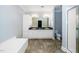 Bathroom features double sink vanity, a soaking tub, and a separate glass-enclosed shower at 1331 Langdon Pl, Pittsboro, NC 27312