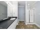 Bathroom featuring a vanity with a mirror and a stand up shower with glass doors at 1331 Langdon Pl, Pittsboro, NC 27312