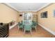 Elegant dining room featuring a glass table, soft lighting, and ample seating for entertaining at 1331 Langdon Pl, Pittsboro, NC 27312