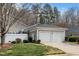 Charming home featuring an attached two-car garage and mature landscaping at 1331 Langdon Pl, Pittsboro, NC 27312
