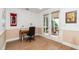 Bright home office with natural light, a desk, and access to a screened-in porch at 1331 Langdon Pl, Pittsboro, NC 27312