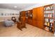 Cozy living room with a built-in bookshelf, comfortable seating, and natural light at 1331 Langdon Pl, Pittsboro, NC 27312