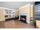 Bright living room with fireplace, hardwood floors, and large windows for natural light at 1331 Langdon Pl, Pittsboro, NC 27312
