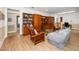 Spacious living room featuring custom wooden cabinets and comfortable seating area, perfect for relaxation at 1331 Langdon Pl, Pittsboro, NC 27312