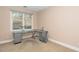 Office room featuring a large window overlooking the outdoors and a metal desk at 1331 Langdon Pl, Pittsboro, NC 27312