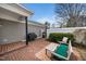 Private brick patio with a grill, seating, and a white privacy wall at 1331 Langdon Pl, Pittsboro, NC 27312