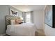 Stylish bedroom featuring neutral decor, a statement headboard, and ample natural light from a window at 140 Holton St, Smithfield, NC 27577
